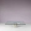 m27666 1970s "Paracarro" Coffee table on stone bse with chrome metal support and glass top / Giovanni Offredi / Saporiti, Italy